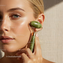 Close Up of Woman Using Jade Facial Roller for Skin Care