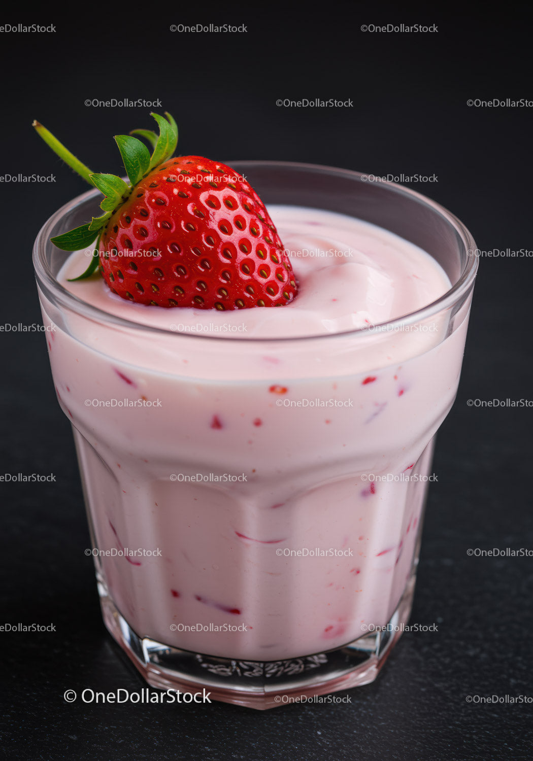 Fresh strawberry topping creamy pink yogurt cup