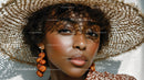 Elegant Woman in Straw Hat and Summer Outfit Outdoors