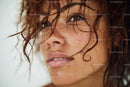 Beautiful Woman with Wet Curly Hair and Natural Makeup
