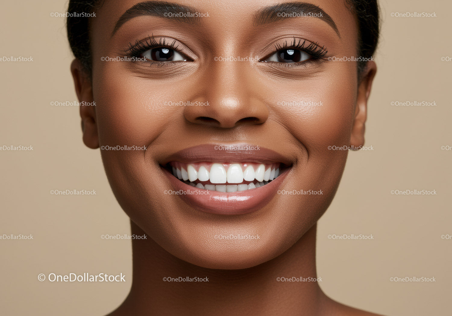 Closeup of smiling woman with flawless skin and teeth