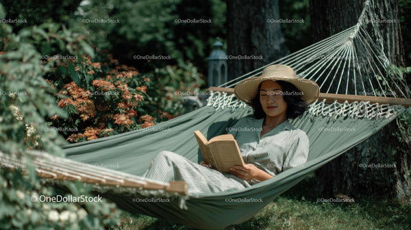 Relaxing Woman Reading in Hammock in a Garden