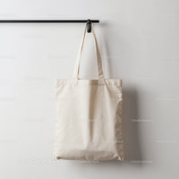 Minimalist Beige Cotton Tote Bag Hanging on Wall Hook