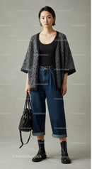 Stylish Young Woman in Casual Fashion with Animal Print Cardigan and Wide Leg Jeans