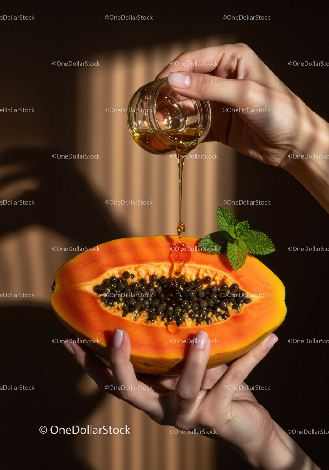 Hands Drizzling Honey Over Fresh Papaya Half