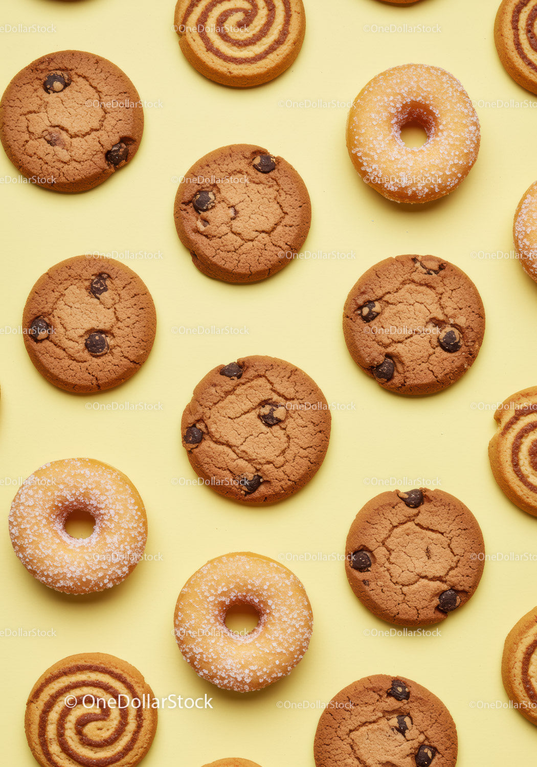 Assorted Cookies and Donuts on Yellow Background
