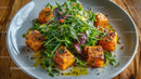 Crispy Tofu with Mixed Greens Salad on Wooden Table