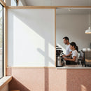 Baristas preparing coffee in bright modern cafe interior