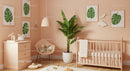 Serene Baby Nursery with Tropical Plant and Wall Art Decor