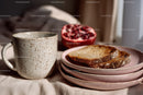 Rustic Breakfast Scene with Toasted Bread Pomegranate and Mug