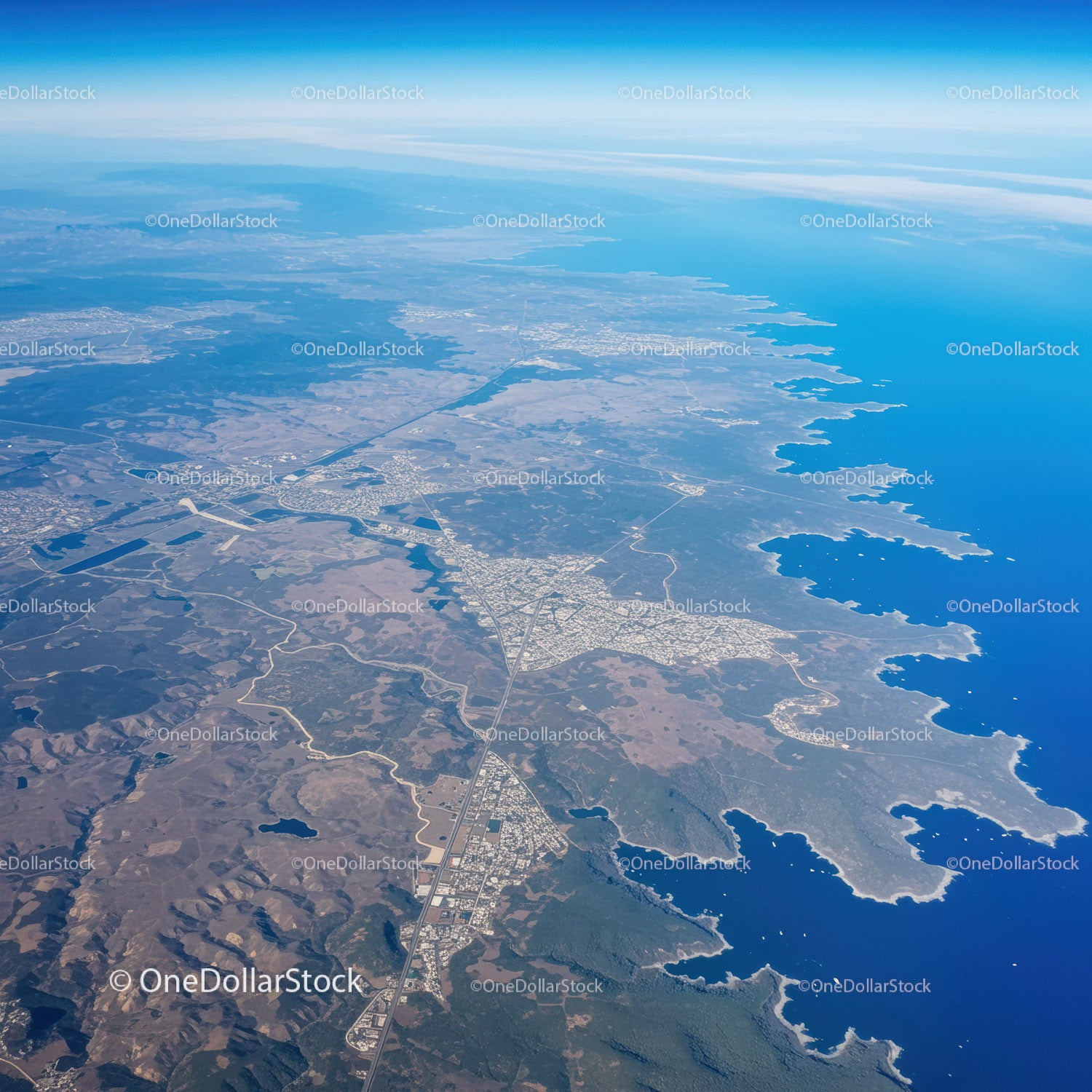 Stunning Aerial View of Rugged Blue Coastline with Islands and Beaches