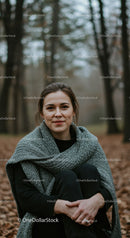 Young woman enjoying peaceful moment in autumn forest
