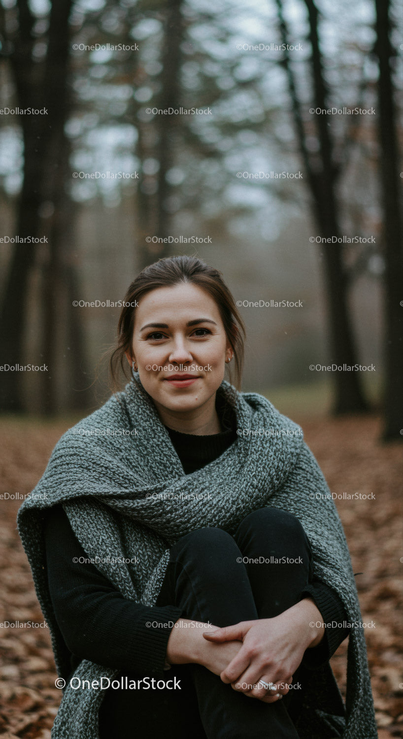 Young woman enjoying peaceful moment in autumn forest
