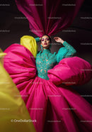 Fashion Model in Vibrant Pink and Yellow Flowing Gown