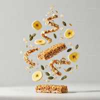 Healthy granola bar with banana slices and seeds levitating