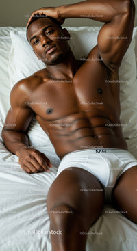Relaxed muscular man lying on bed in white underwear
