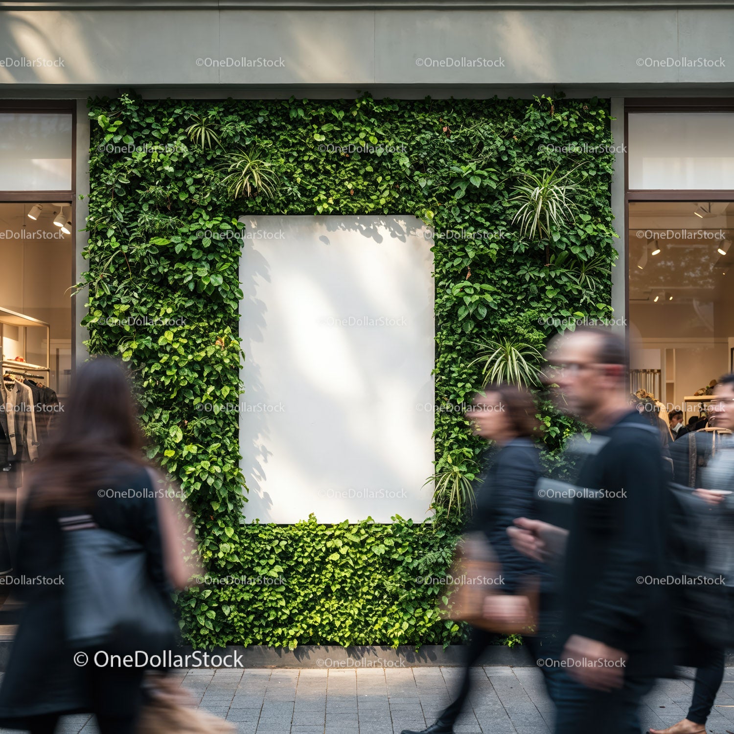 Urban green wall framing blank white poster on city street