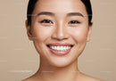 Close up of smiling young woman with flawless skin