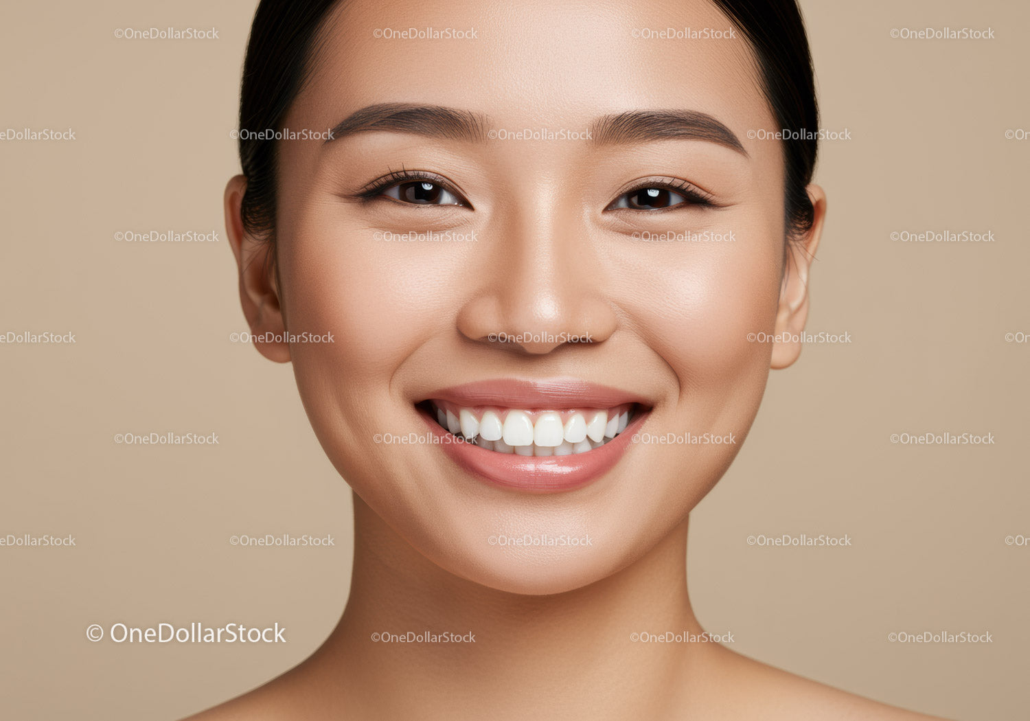 Close up of smiling young woman with flawless skin