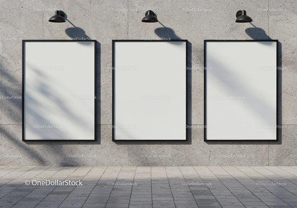 Three blank vertical posters on modern concrete wall JPG Mockup Image