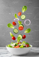 Fresh Vegetable Salad Ingredients Falling Into Bowl