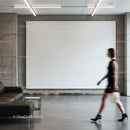 Blurred woman walking in modern minimalist lobby space