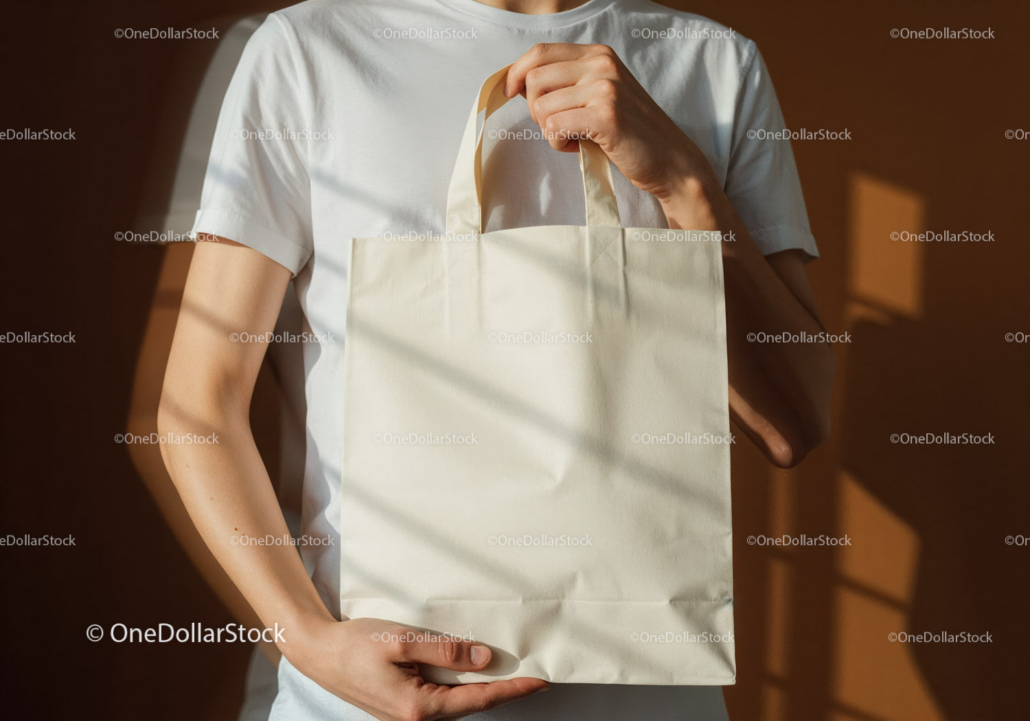 Person holding blank beige reusable tote bag