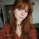 Portrait of a Young Woman with Red Hair and Blue Eyes in Casual Outfit