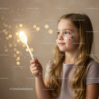 Young girl with star stickers holding glowing spoon
