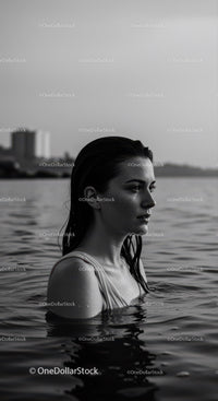 Serene Woman in Water with Reflective Calm Atmosphere