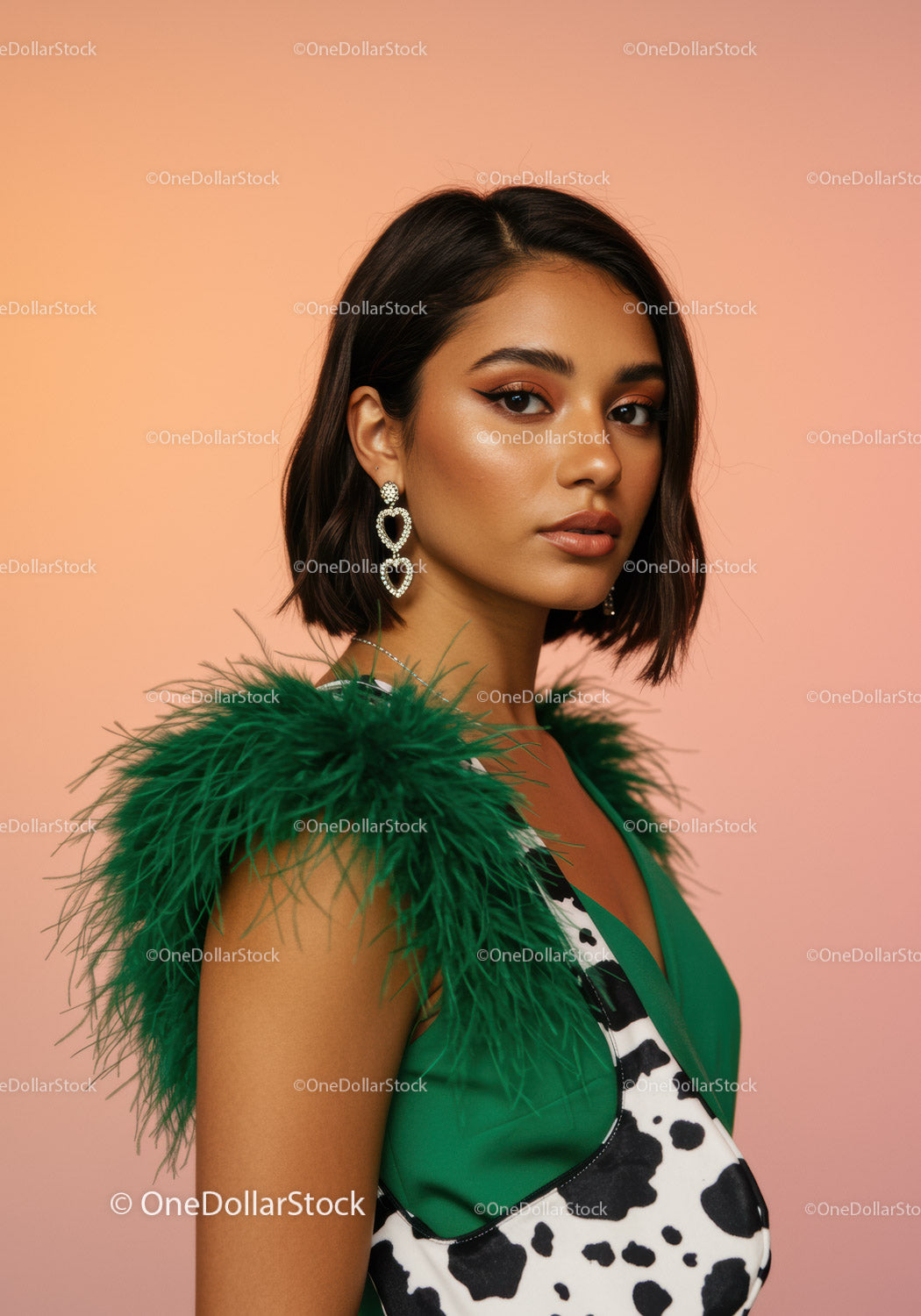 Elegant Fashion Portrait of a Woman in a Green Feathered Dress and Statement Earrings