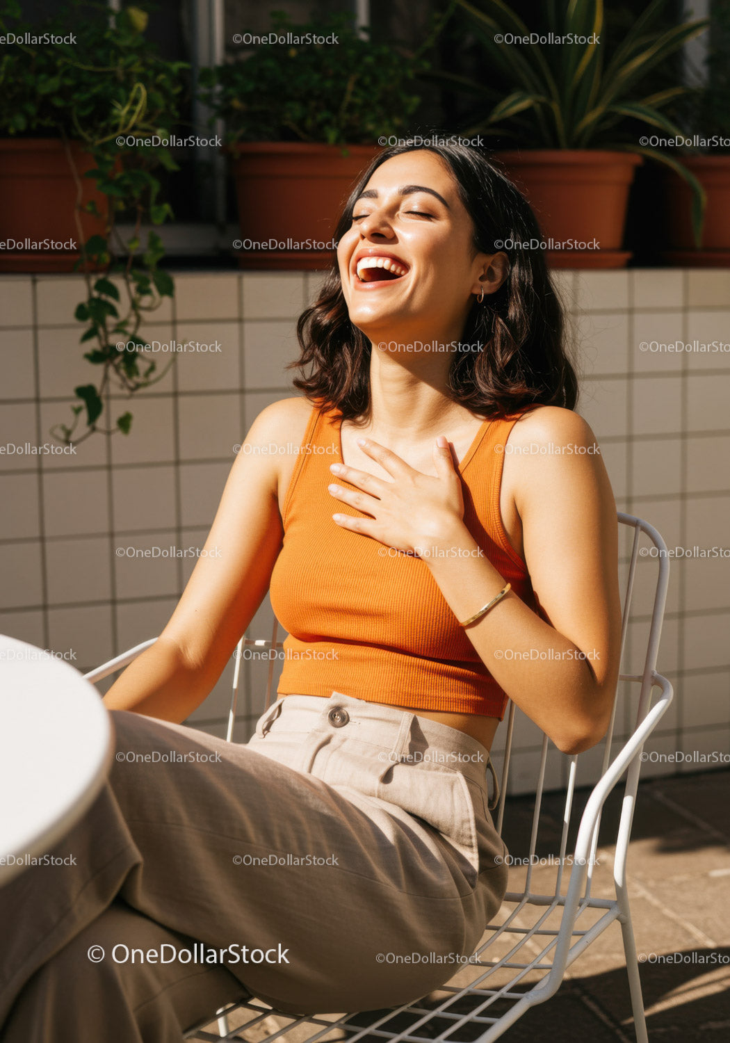 Joyful Woman Laughing Outdoors in Bright Casual Outfit