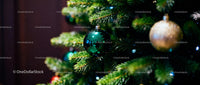 Green and Gold Christmas Ornaments on Pine Tree