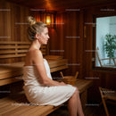 Relaxing Woman Sitting in Sauna with Wooden Interior and Natural Light