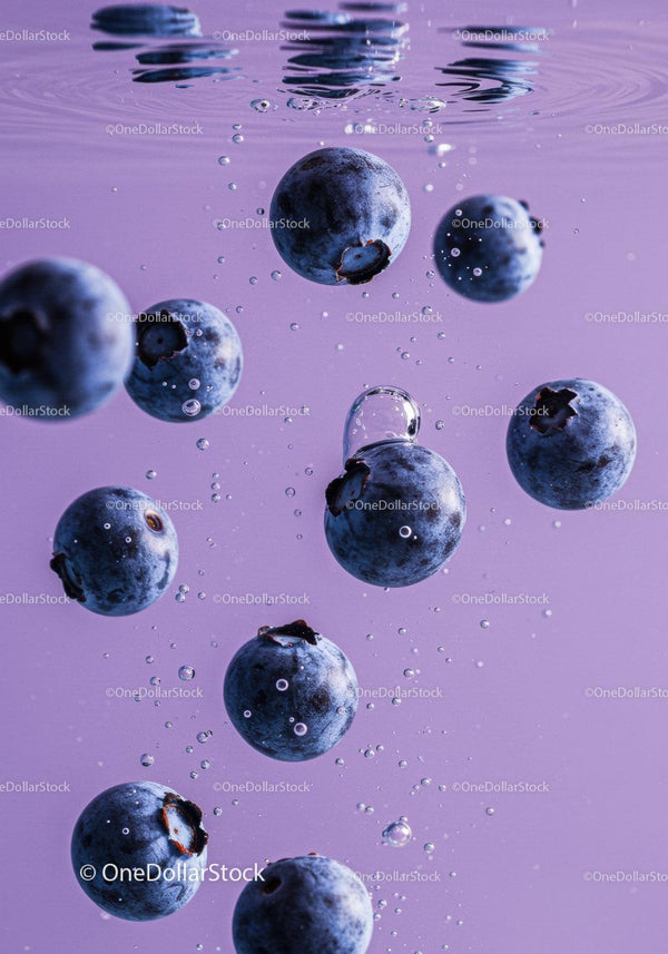 Fresh blueberries sinking in sparkling water