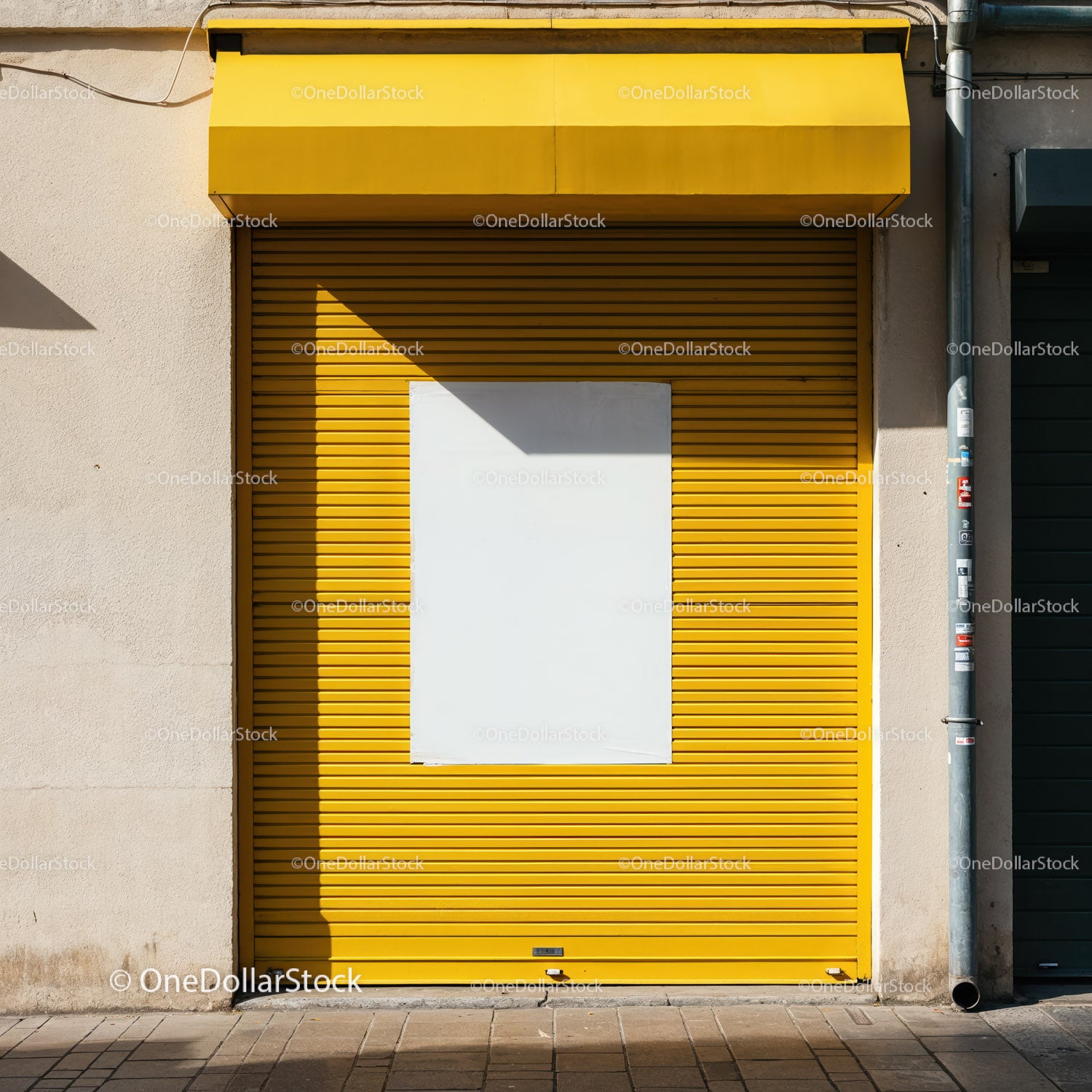 Closed yellow storefront with blank white poster