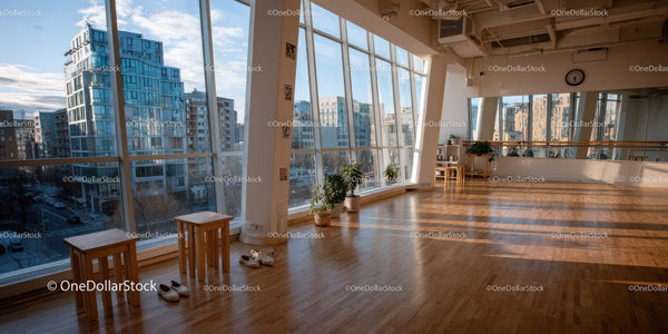 Bright Urban Interior with Large Windows and City View