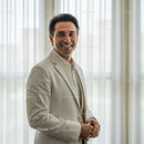 Confident Smiling Businessman in Modern Office Portrait