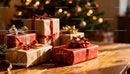 Festive Christmas gifts wrapped with ribbons on wooden table