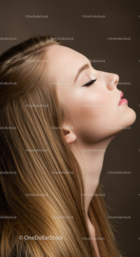 Profile of serene young woman with flawless makeup