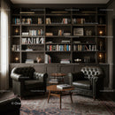 Cozy reading nook with leather armchairs and bookshelf
