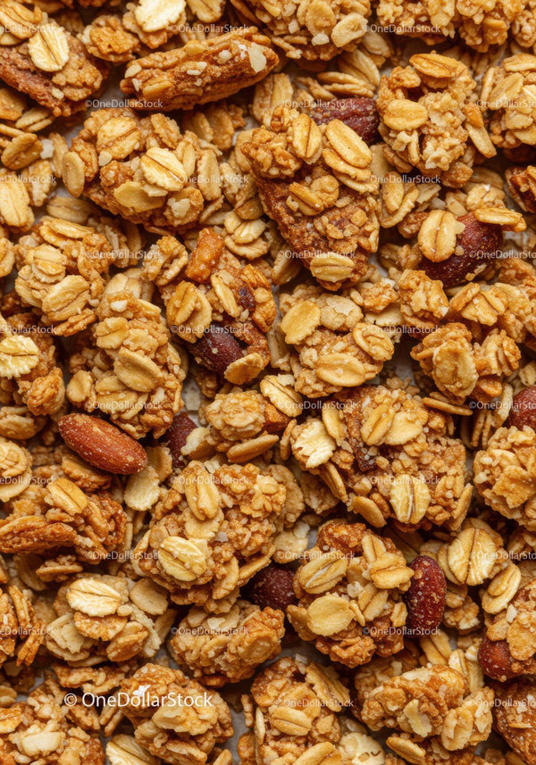 Crunchy oat granola clusters with roasted almonds closeup