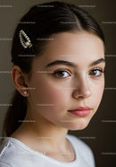 Elegant Young Woman with Brown Eyes and Pearl Hair Clip