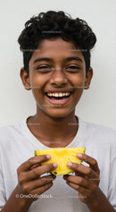 Smiling Boy Enjoying Fresh Pineapple in Bright Childhood Portrait