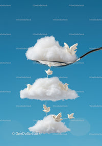 Creative clouds and birds arranged on a spoon in blue sky