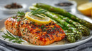Fresh Grilled Salmon with Lemon and Green Asparagus on White Plate