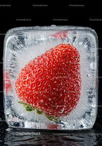 Fresh strawberry encased in a clear ice cube