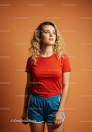 Young woman with curly hair in casual sporty outfit