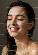 Close-Up of Smiling Woman with Facial Exfoliating Scrub