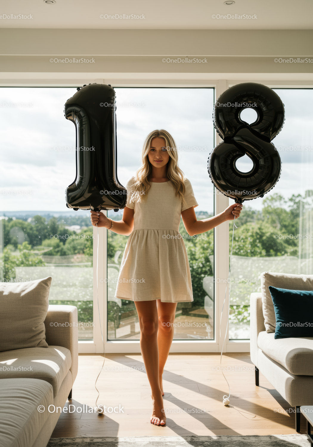 Young woman celebrating 18th birthday with balloons indoors